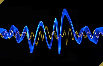 Blue and yellow audio waveforms representing frequencies.