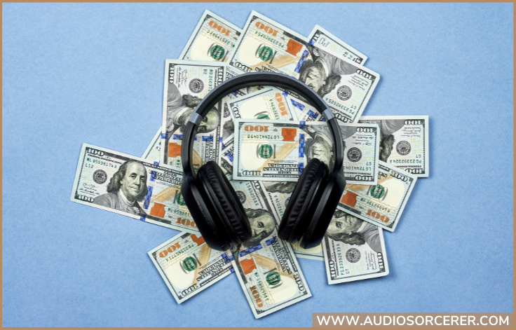 Picture of 100 dollar bills with headphones on them.