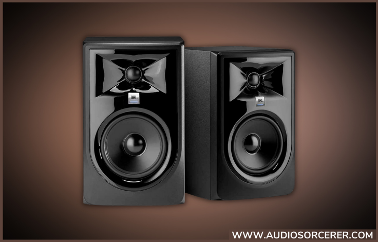 JBL 305P MkII 5-inch powered studio monitors with a brown and black background.