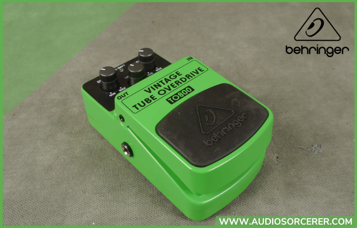 Behringer TO800 Vintage Tube Overdrive Pedal sitting on a ripped up carpet.