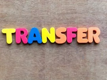 The word "transfer" spelled out in neon colors.