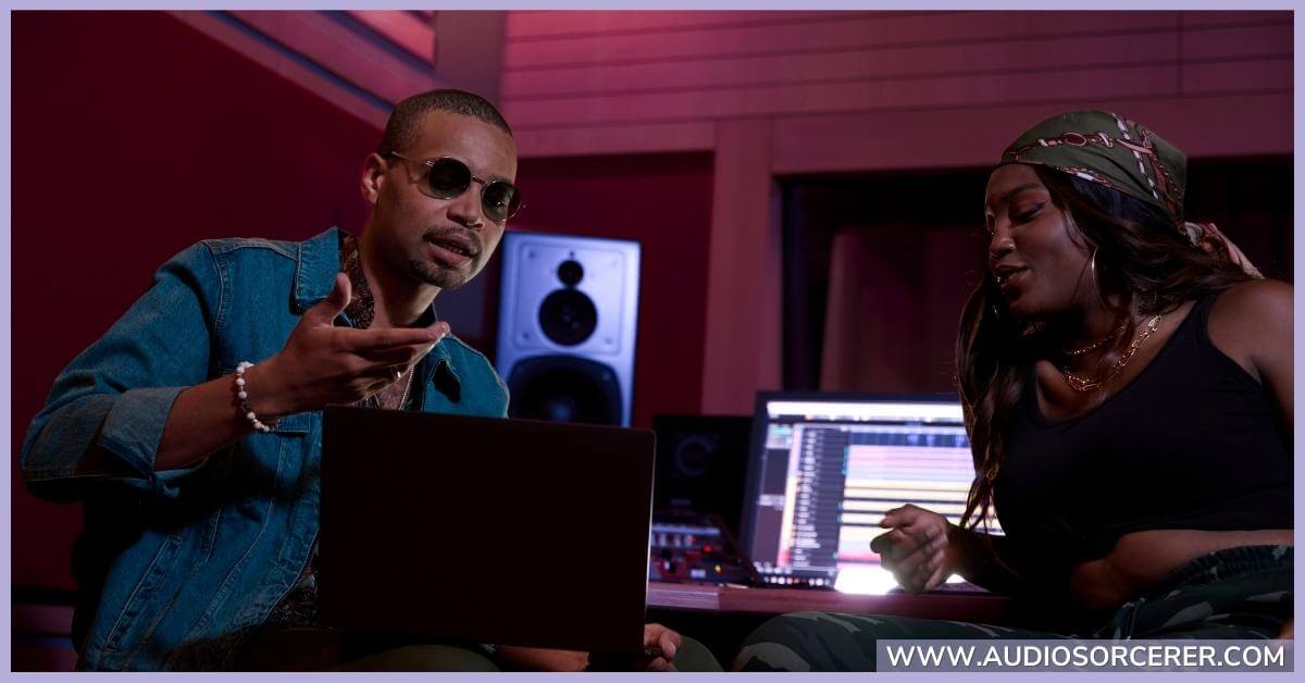 Music producer discussing a project with a client.