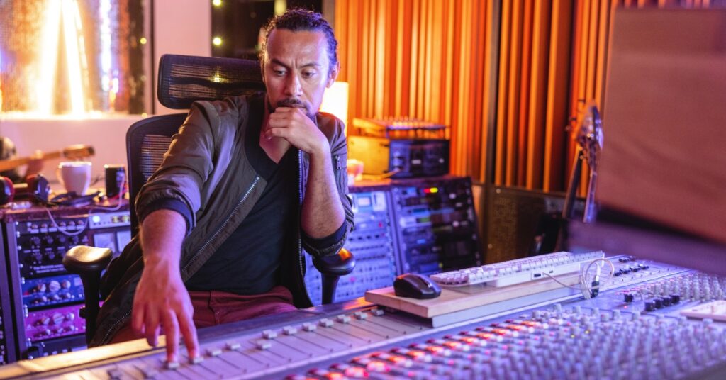 Audio engineer mixing in the studio.