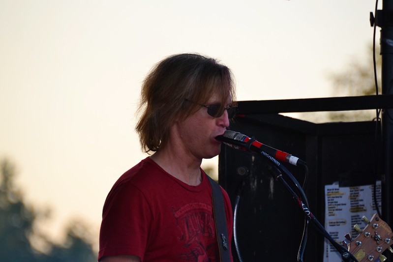 Live performer using a talkbox.