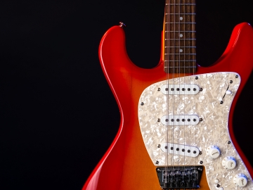 Pearloid guitar pickguard.